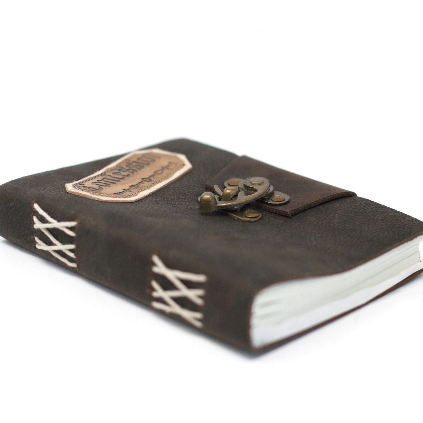 Brown leather notebook with a clasp on a white background