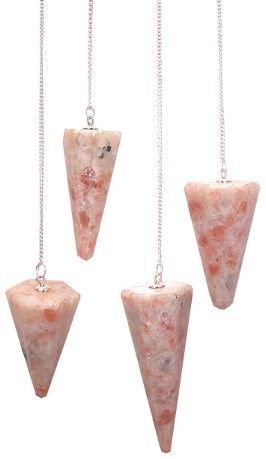 Four pink stone pendulums on silver chains against a white background