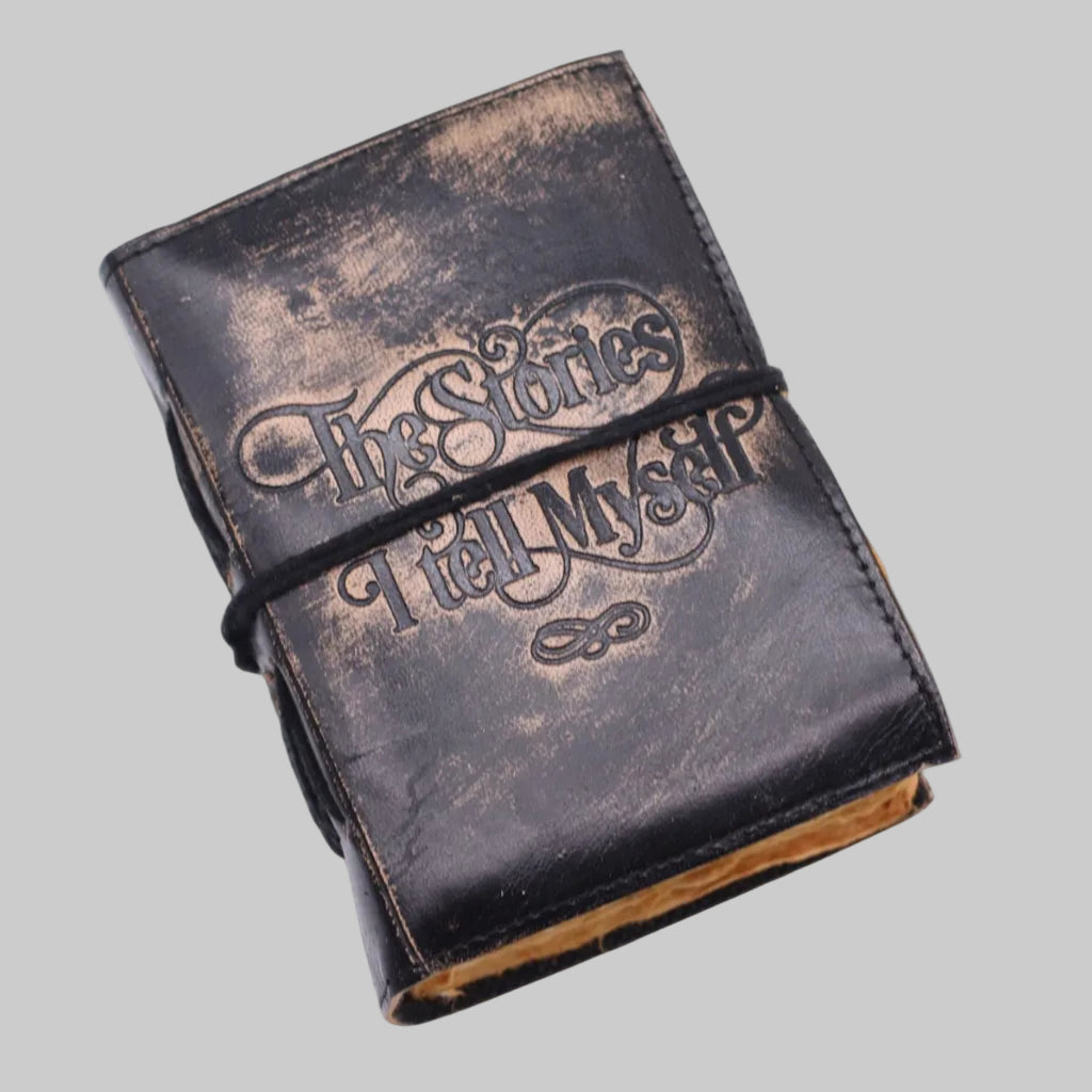 Vintage-style leather-bound book with embossed text on a white background