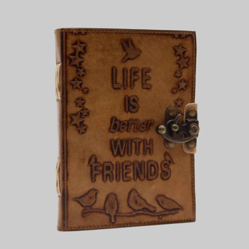Brown leather journal with 'Life is better with friends' engraving on a white background