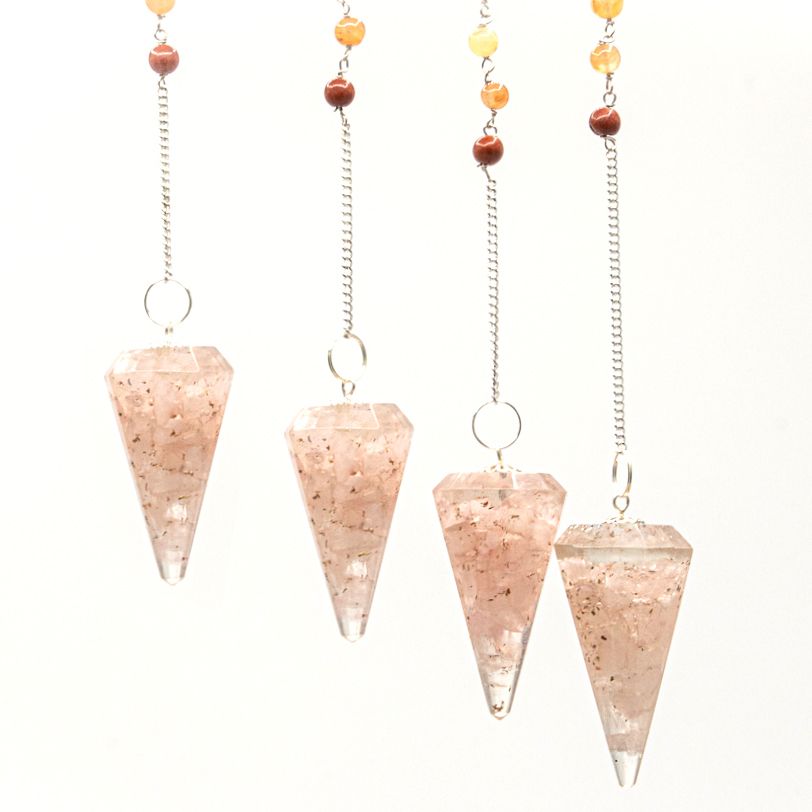 Set of four pink crystal cones with chains on a white background