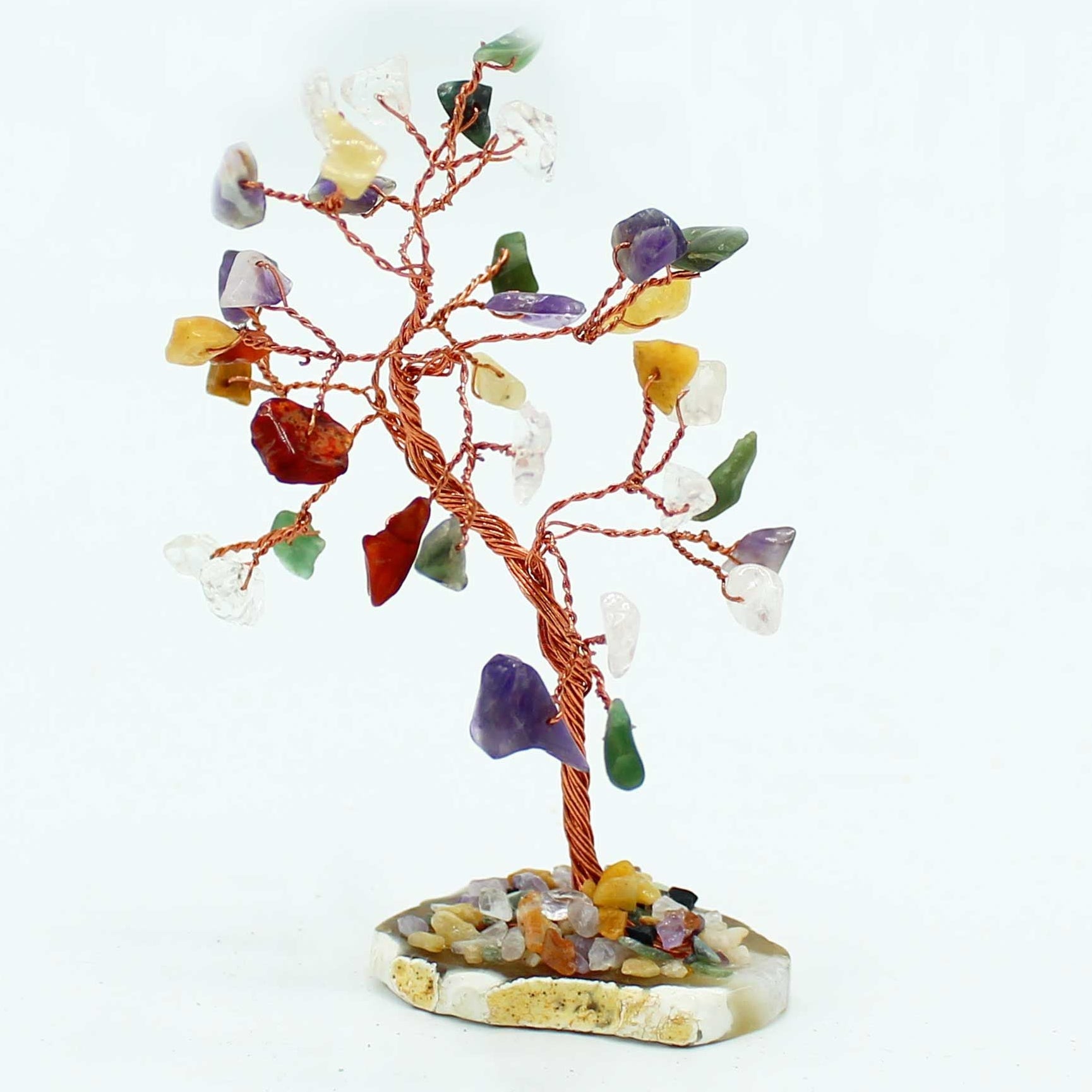 Crystal tree with multicolored stones on a white background