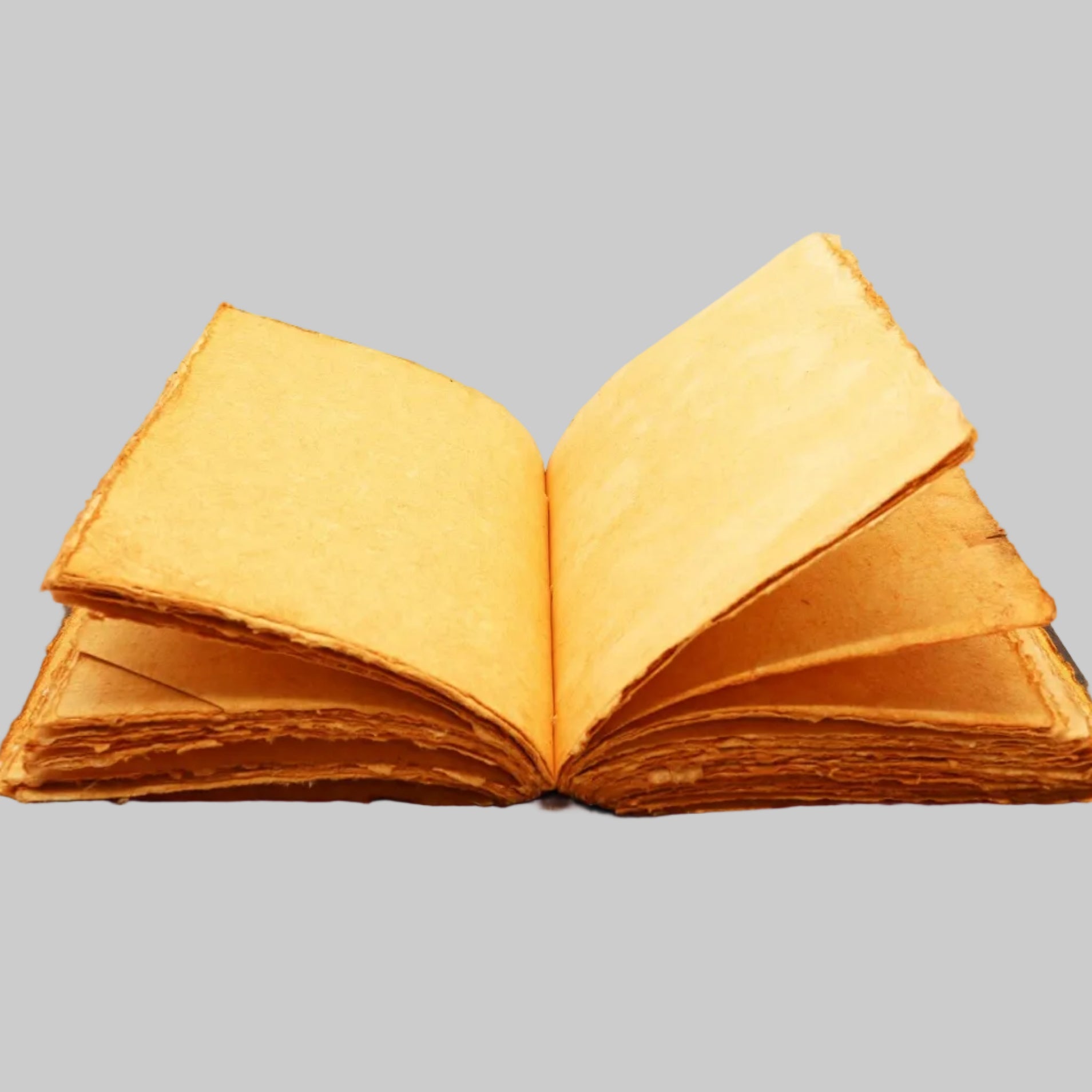 Open book with yellowed pages on a white background