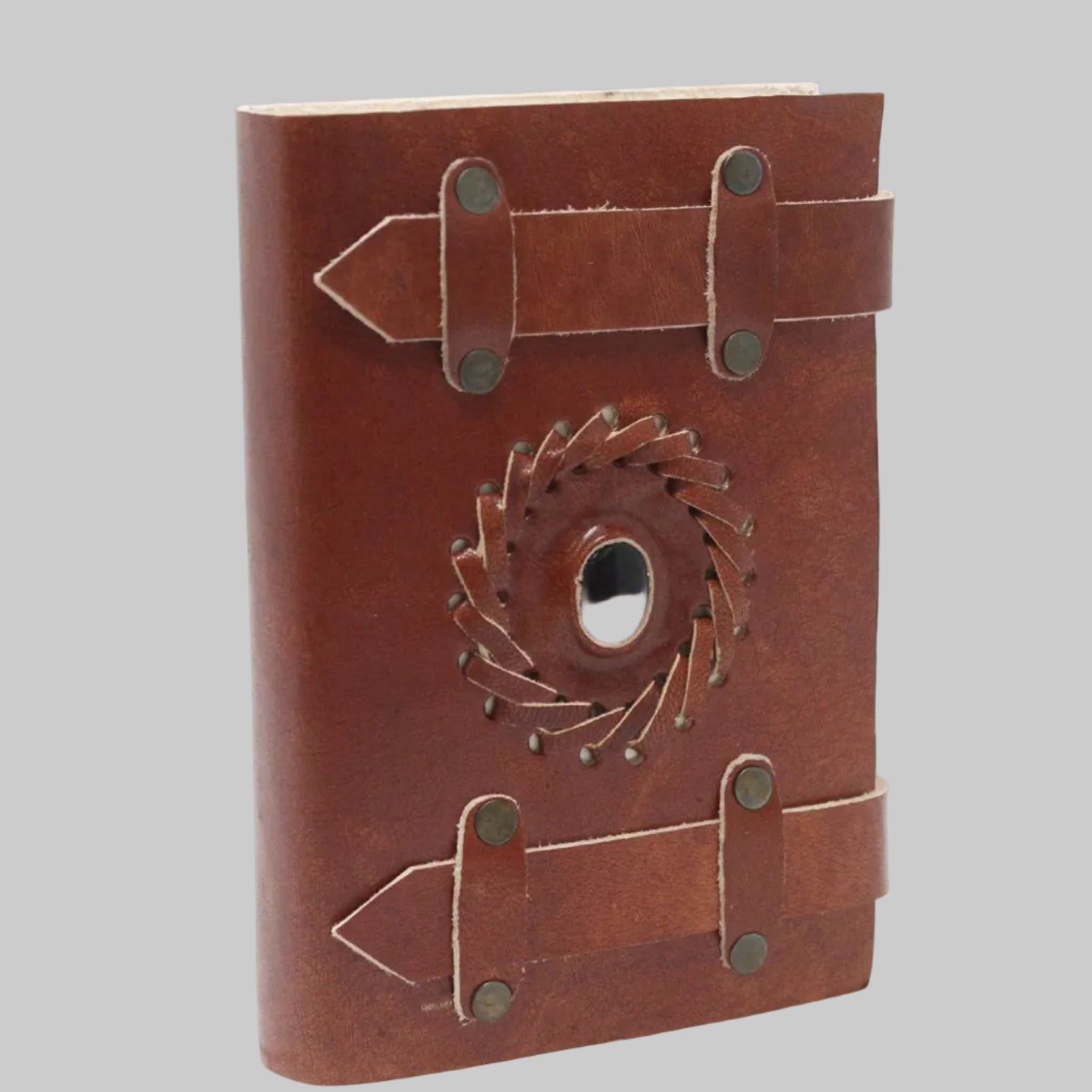 Brown leather notebook with gear design on a white background