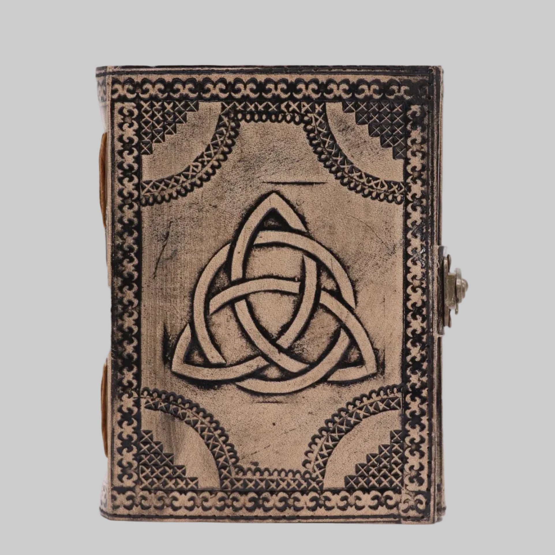Decorative notebook with Celtic knot design on a white background