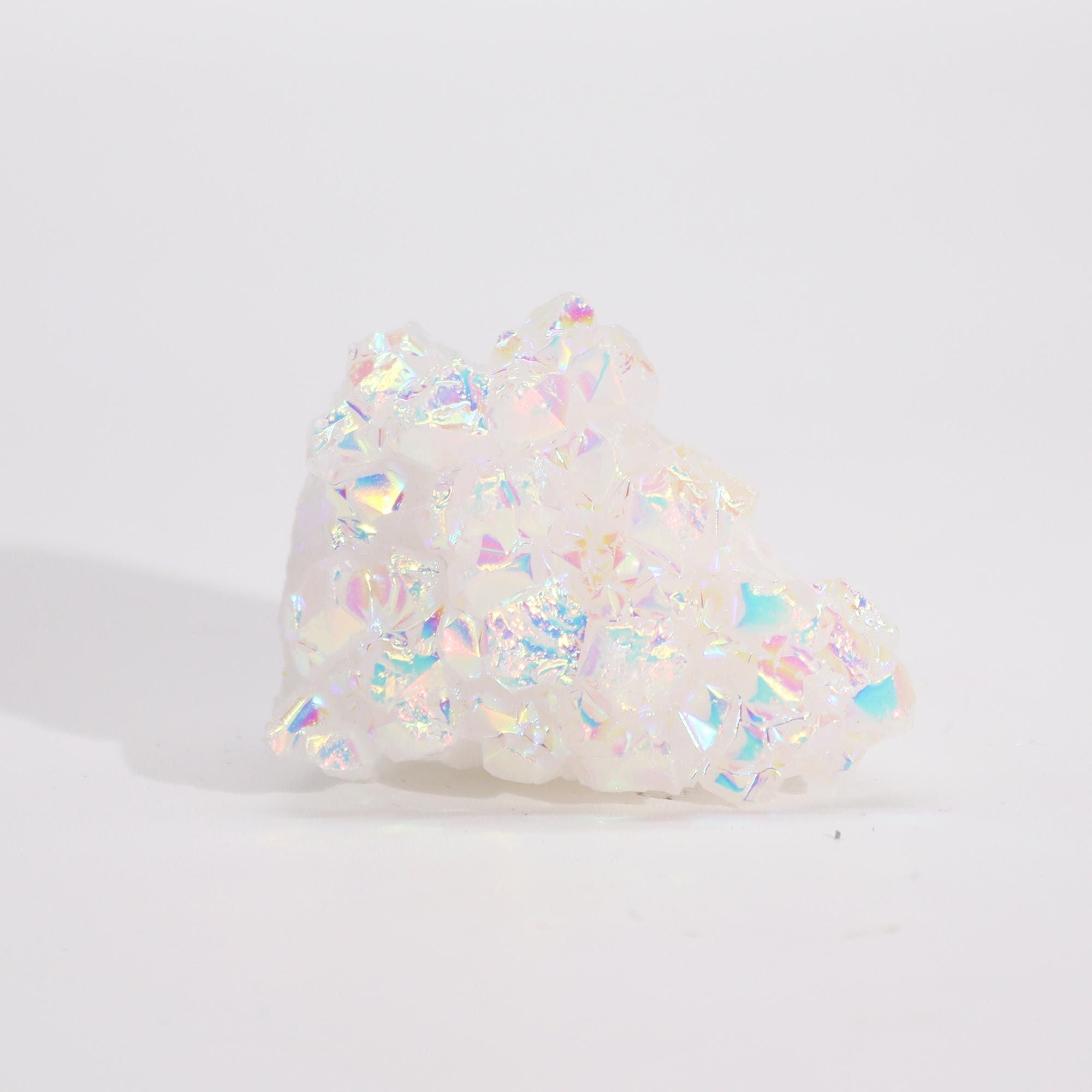Iridescent crystal rock on a white background
