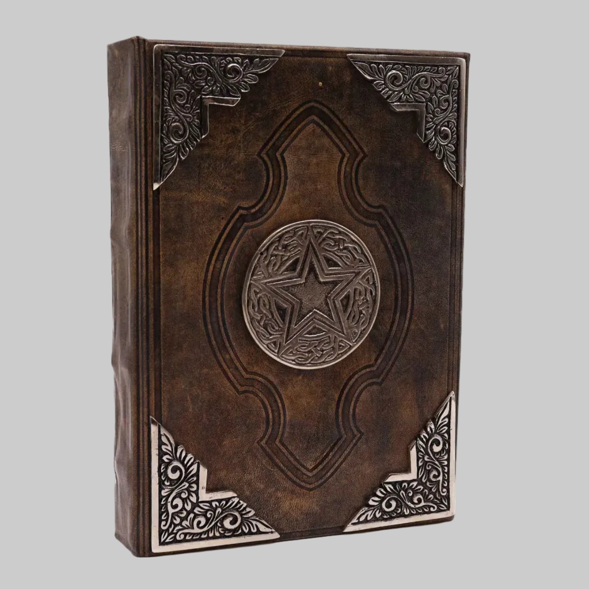 Decorative leather-bound book with star design on a white background