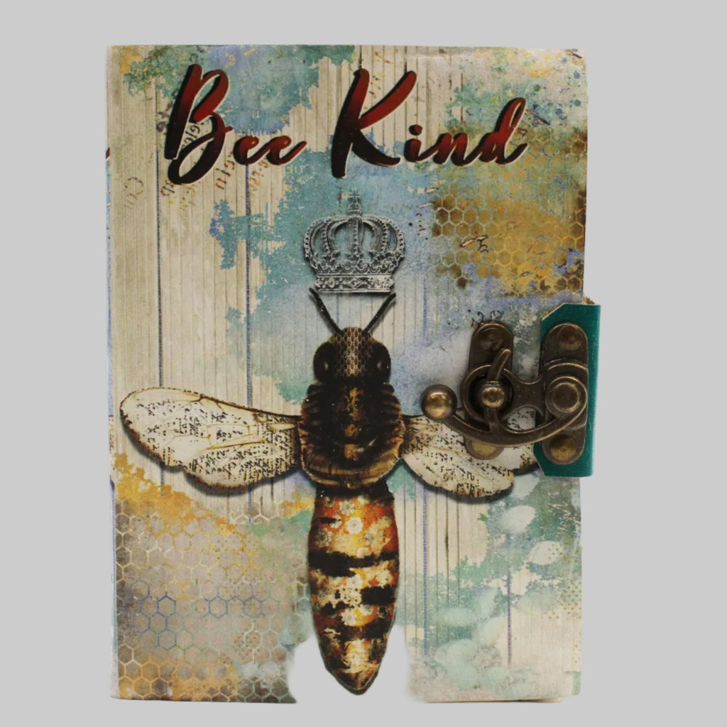 Notebook with a bee design and 'Bee Kind' text on a textured background