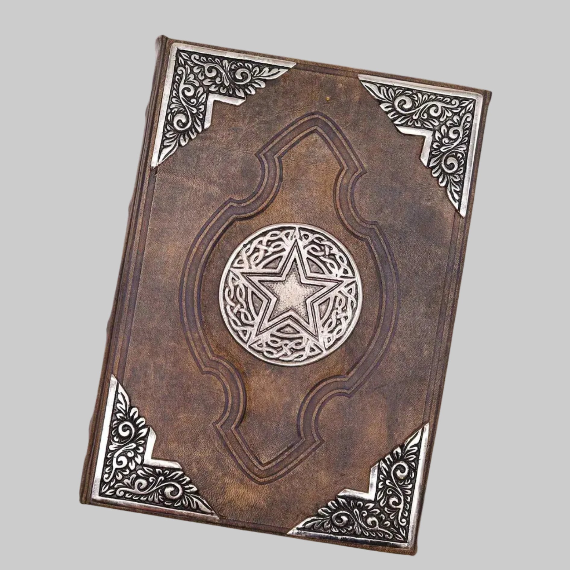 Decorative leather-bound book with star design on a white background