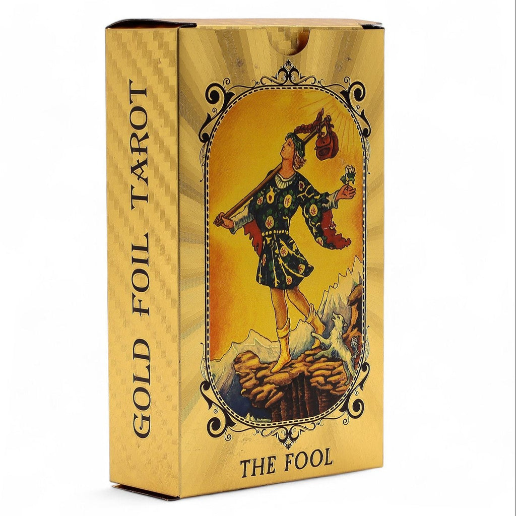 Gold foil tarot card box with 'The Fool' illustration on a white background