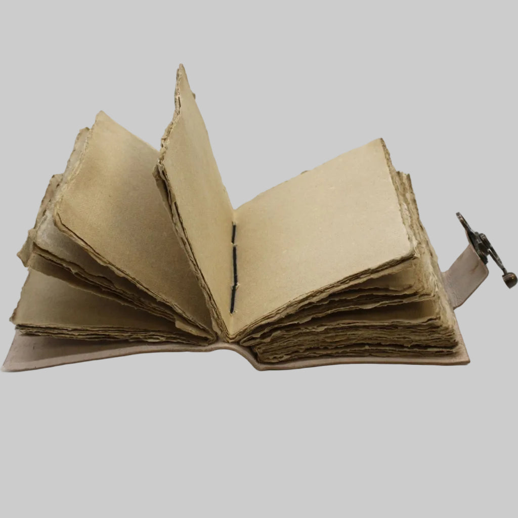 Open cardboard book with a strap on a white background