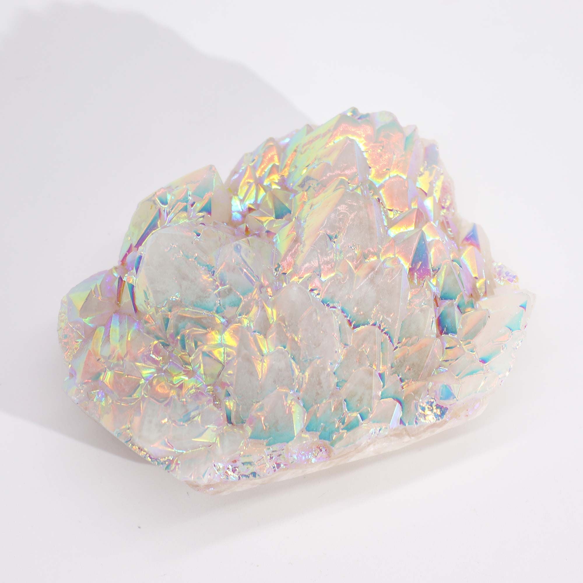 Iridescent crystal rock on a white background