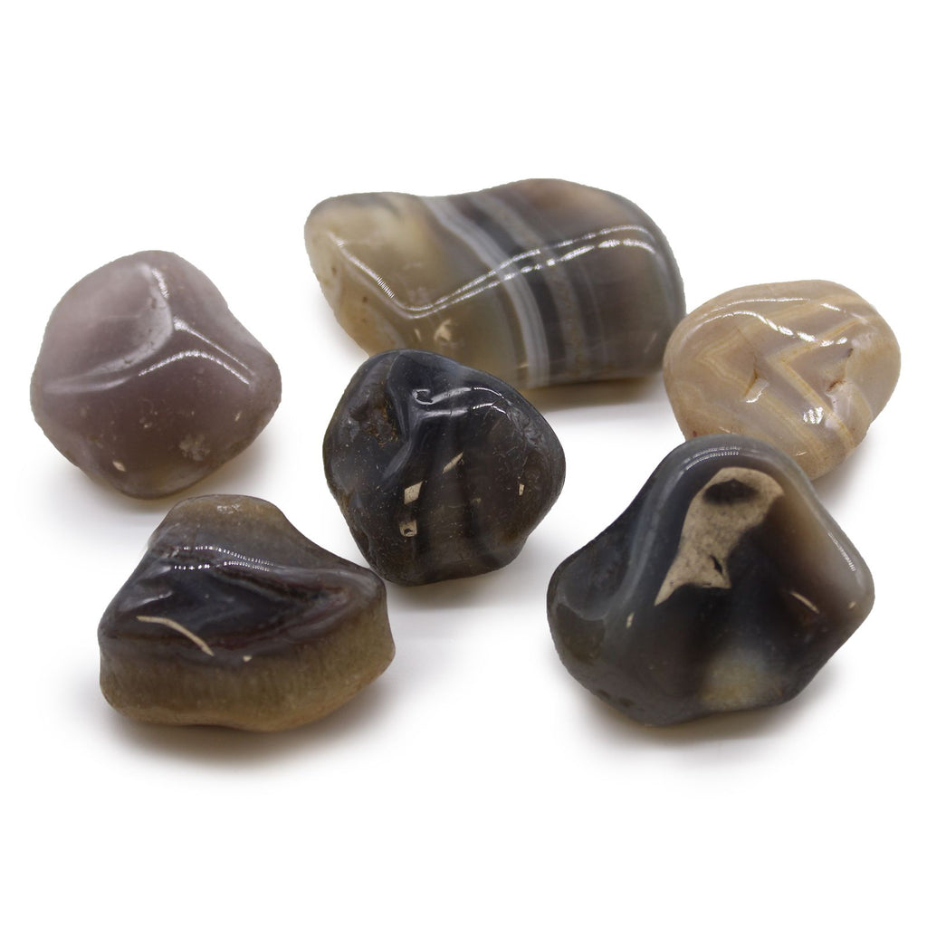 Set of polished agate stones on a white background