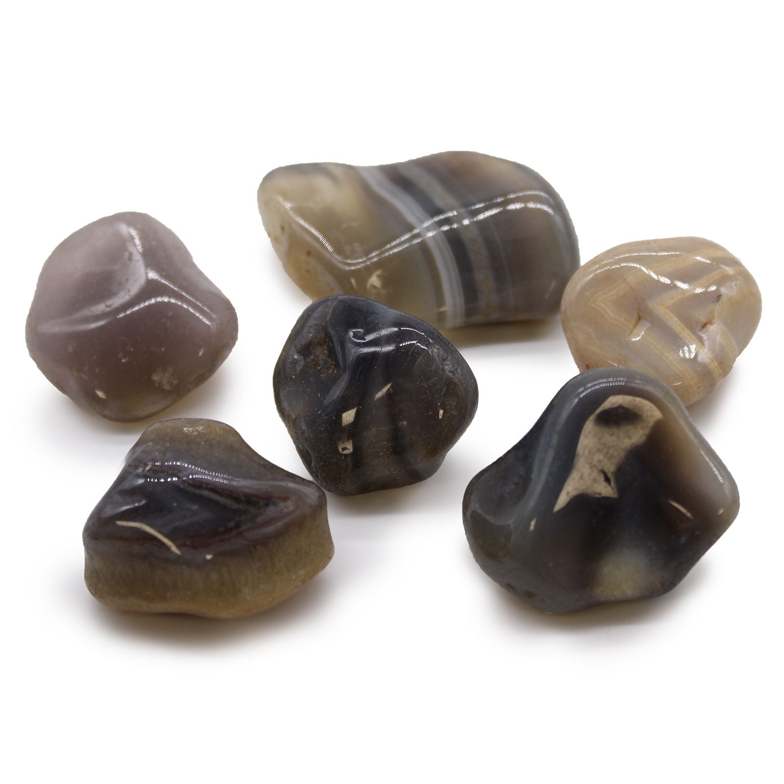 Set of polished agate stones on a white background